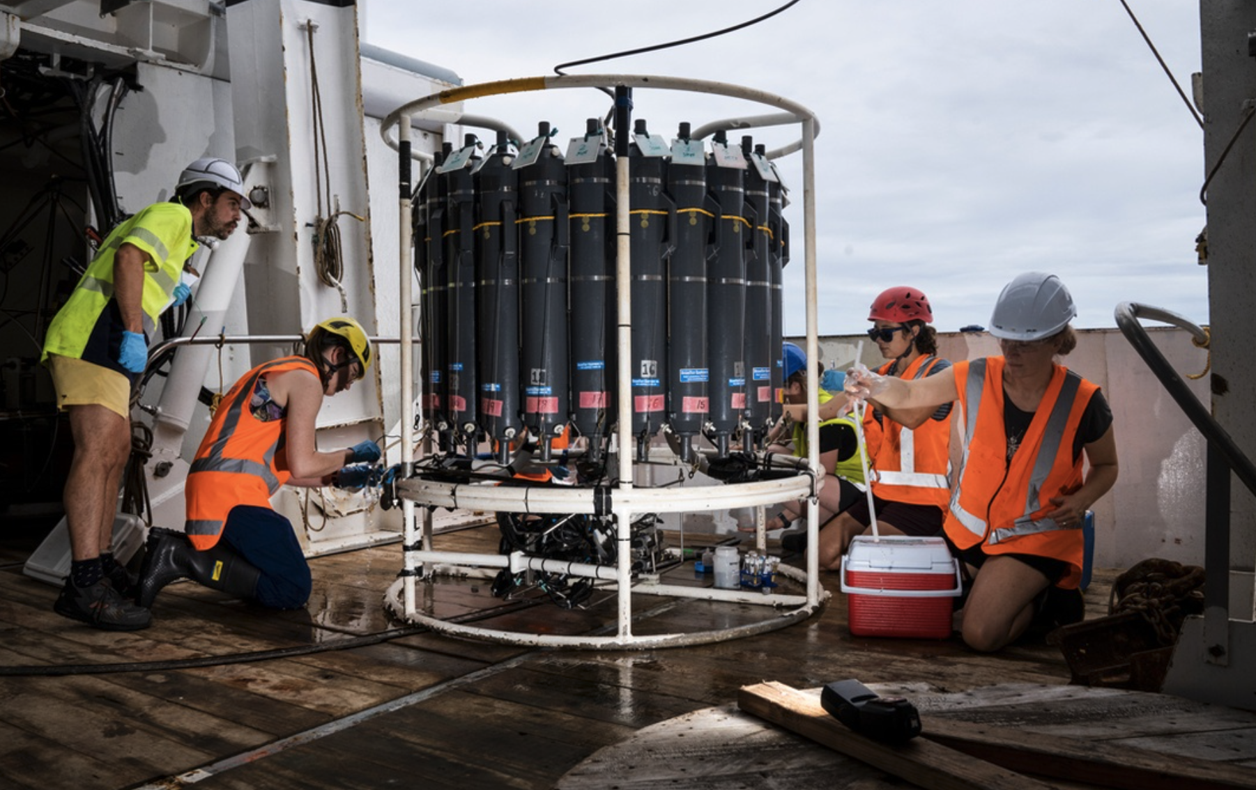 3 Researchers collect water from the CTD after a deployment