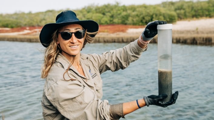 Blue Carbon Seascapes scientist Dr Kay Davis with a soil core collected at Mangrove Bay, near Exmouth