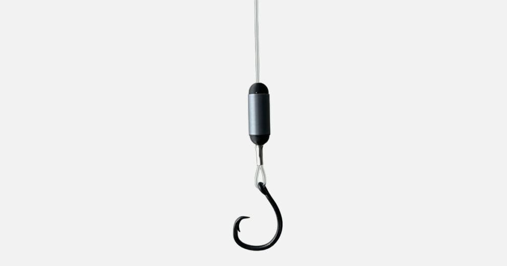 The patent-pending device uses a simple zinc and graphite combination to generate a weak electric field that repels sharks without affecting target fish.