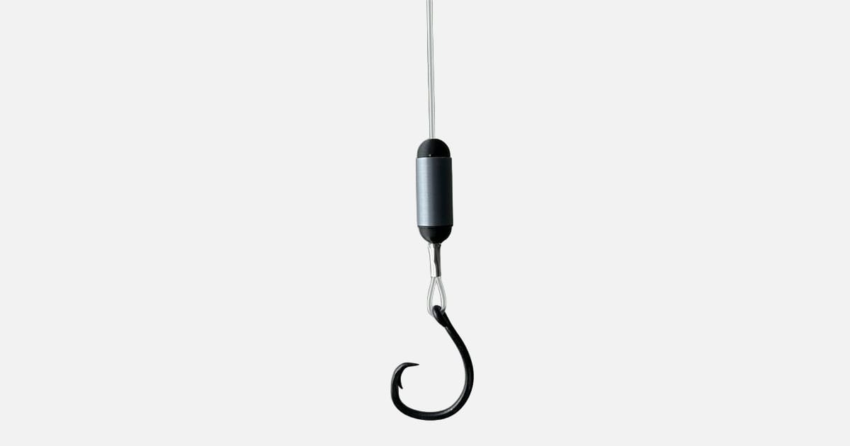The patent-pending device uses a simple zinc and graphite combination to generate a weak electric field that repels sharks without affecting target fish.