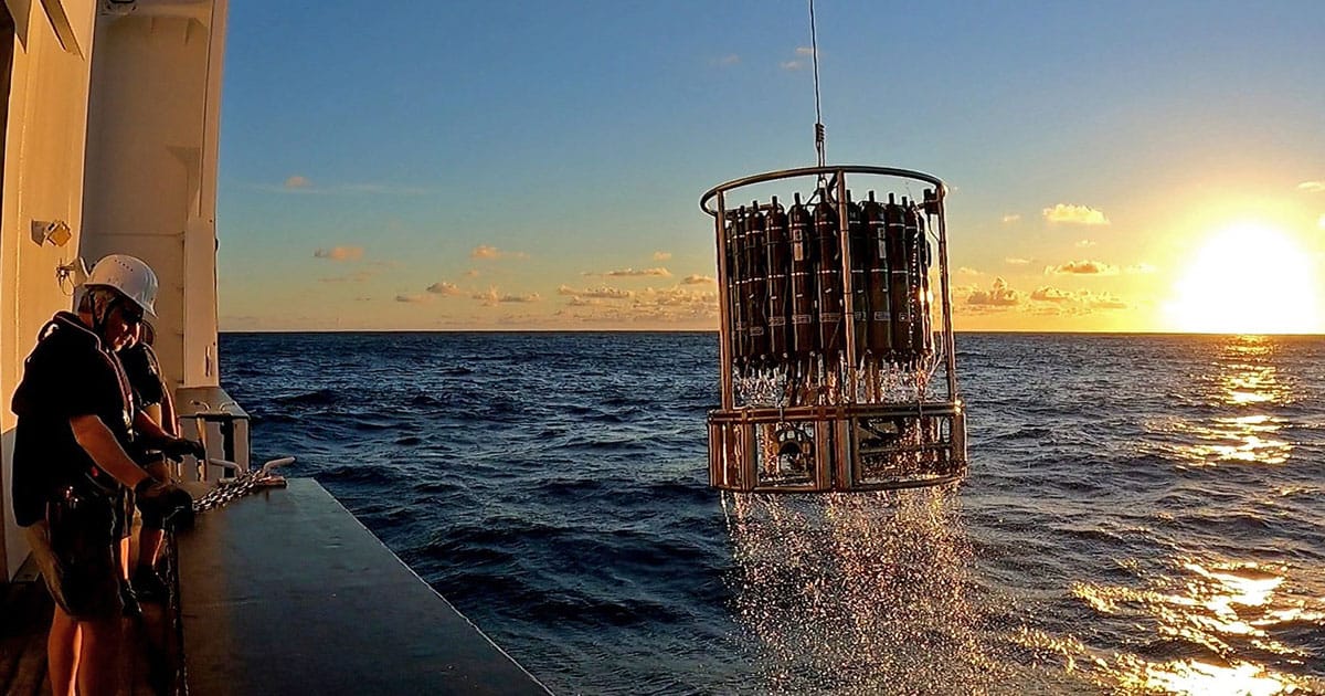 A rosette water sampler with water samples is brought back on board the German research vessel SONNE on expedition SO289 in the South Pacific.