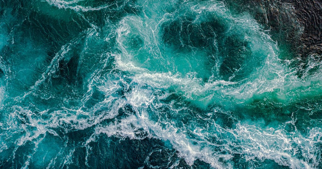 Waves of water of the river and the sea meet each other during high tide and low tide.