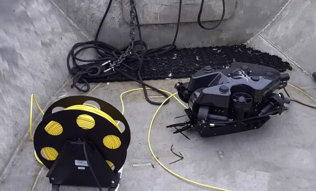 A PHOTON ROV being deployed from a small vessel.