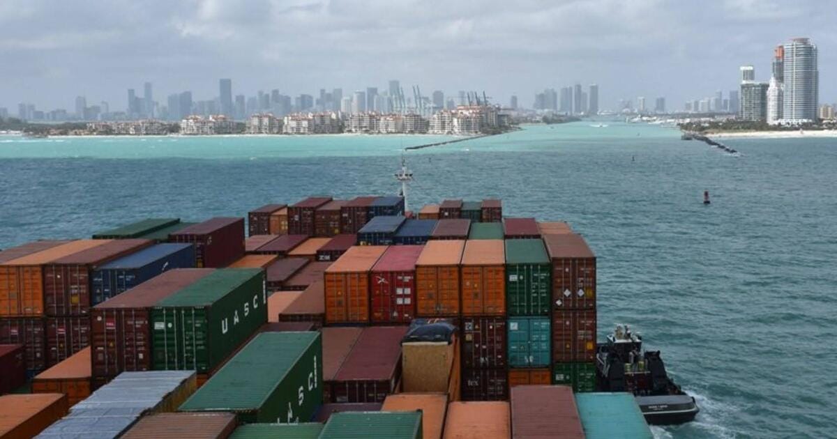 A cargo ship safely entering the port of Miami in Florida.