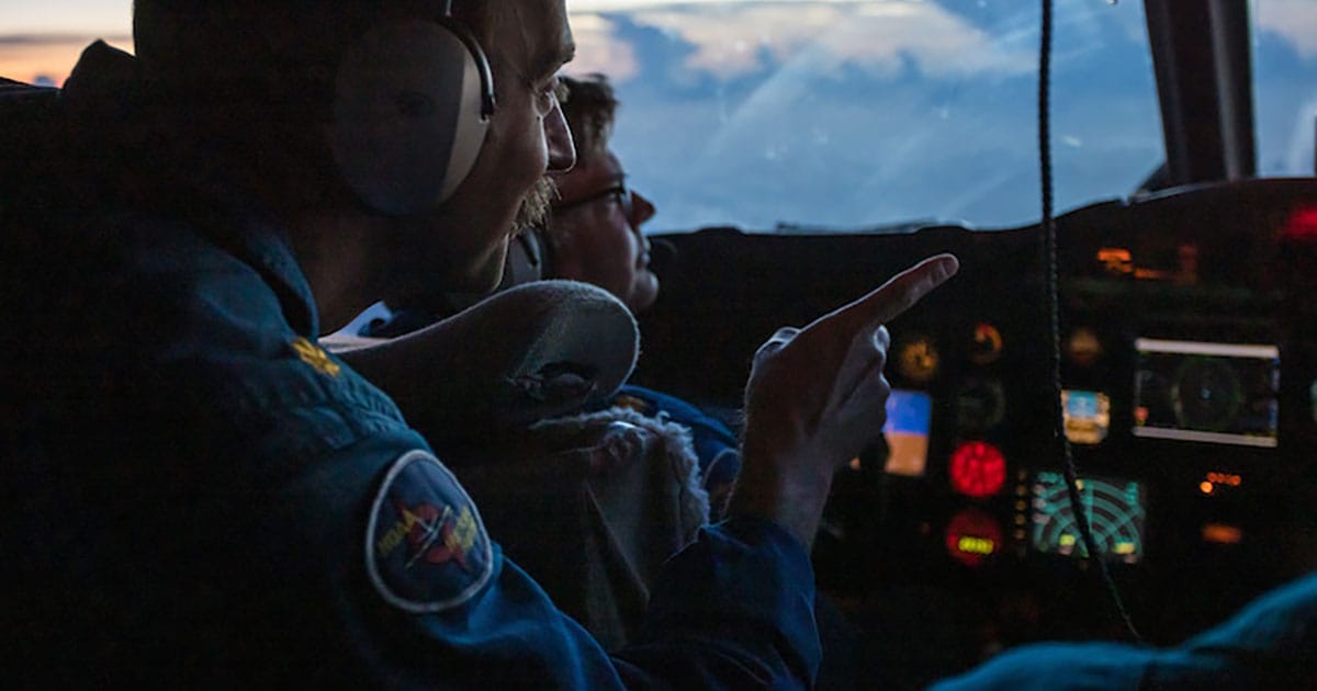 NOAA Corps officers Lt. Cmdr. Brett Copare and Lt. Cmdr. David Keith at the controls of NOAA WP-3D Orion N43RF during a flight to Hurricane Lee on Sept. 8, 2023.
