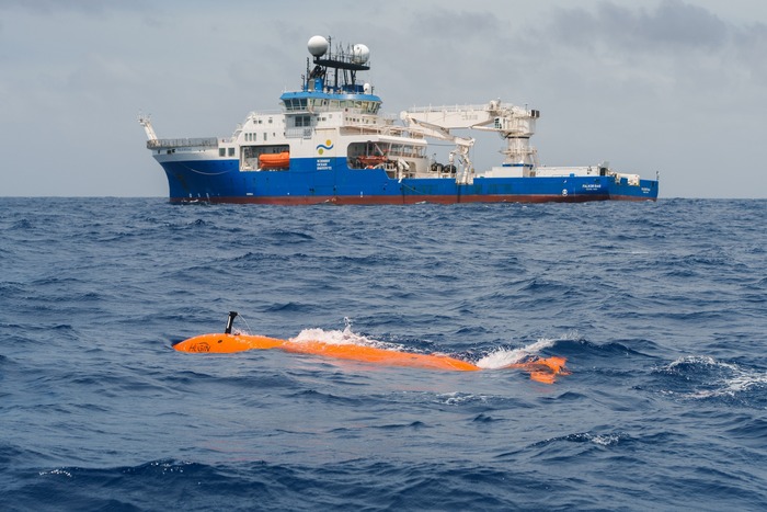 The Autonomous Underwater Vehicle (AUV) The Childlike Empress, cruising alongside Research Vessel Falkor (too), before diving thousands of meters below the ocean’s surface on a mapping mission. The science team used shipboard sonar to map the region, followed by The Childlike Empress AUV to generate high-resolution maps and collect environmental data in the target area. These maps allowed scientists to pinpoint precise coordinates for SuBastian deployment, leading to the discovery of two new active hydrothermal vent fields in record time. (Image credit: Alex Ingle, Schmidt Ocean Institute)