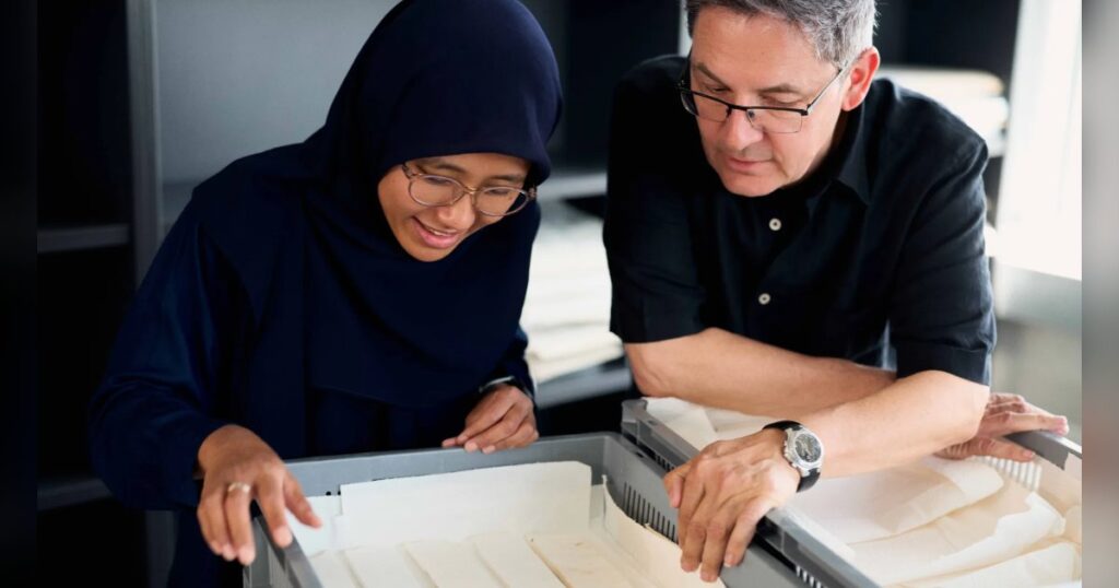 MARUM researchers Hana Camelia and Thomas Felis examining cores of tropical coral colonies. (Image credit: Patrick Pollmeier, University of Bremen)
