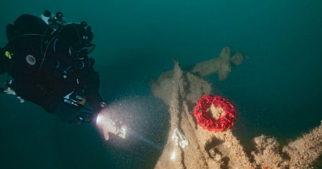 Ricardo Constantino laying wreath on tiller of HMS Tiger. (Credit: Guy Trees)
