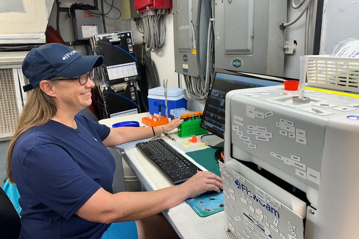 Lubelczyk runs the FlowCam aboard the R/V Point Sur. (Image credit: Sierra Sarkis, NOAA NCCOS)