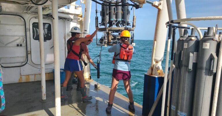 Measuring a 'dead zone': Scientists retrieve the CTD (conductivity, temperature, depth) package of ocean sensors after profiling dissolved oxygen at a station during the Shelfwide Hypoxia Cruise in the Gulf of America.