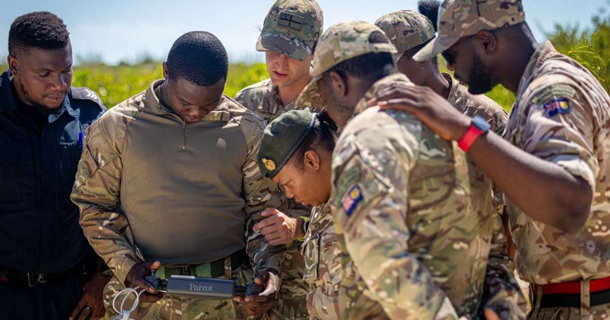 Members of the Turks and Caicos Regiment are shown ways of using drones for disaster relief by 700X Naval Air Squadron