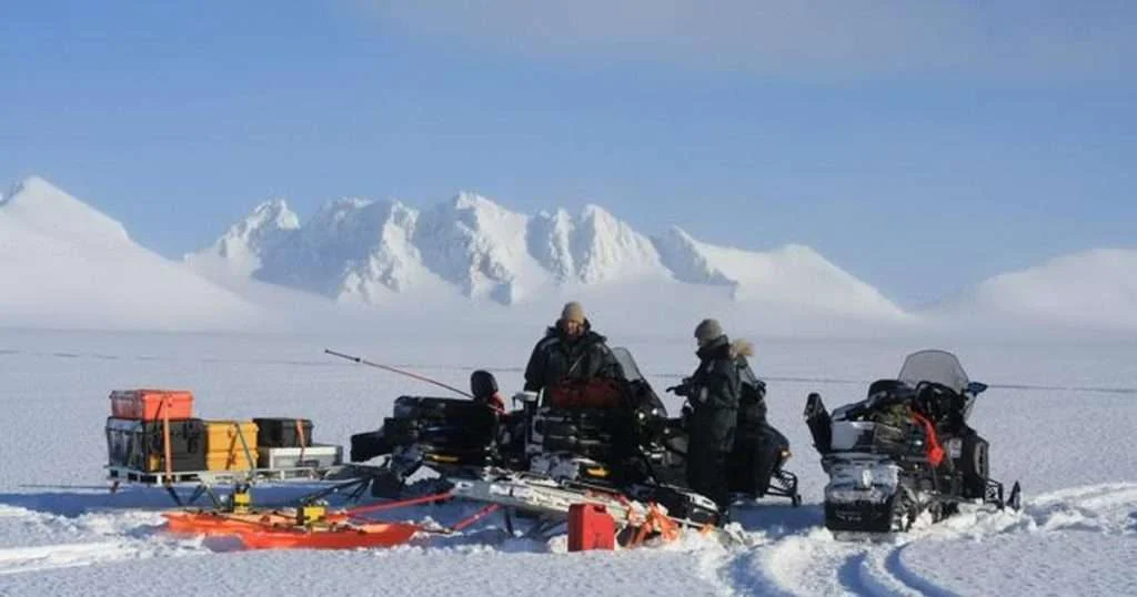 Conducting a radar survey on a Svalbard glacier during winter. (Image credit: Gabrielle Kleber)
