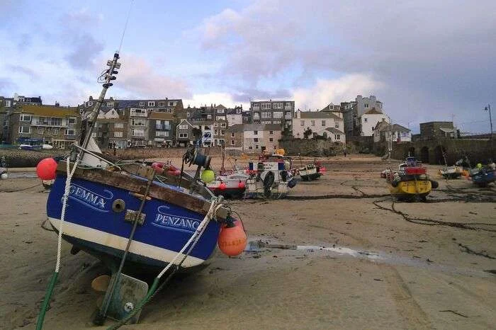 Fishing boats pictured at low tide at the harbour of St Ives, Cornwall. The seafood sector is key to Cornwall (and Isles of Scilly), with 2.9% of jobs depending on seafood (versus 0.7% of UK jobs). In 2024, 21.8 kilotonnes of seafood were landed in Cornwall (and Isles of Scilly), for a value of £54.3 million. (Image credit: PML)