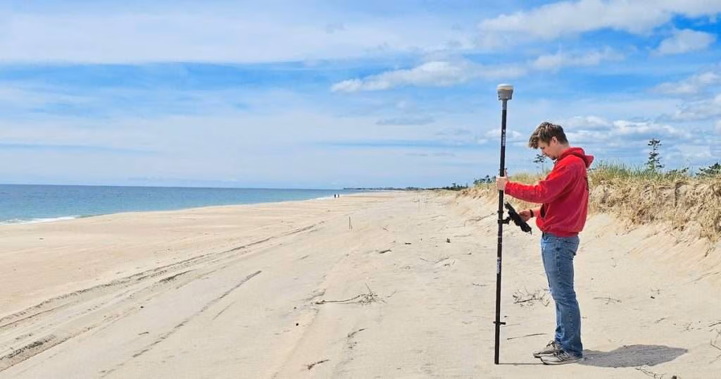 Student Jake Harrington uses real-time kinematic global positioning system for a beach survey. (Image credit: J.P. Walsh, URI)