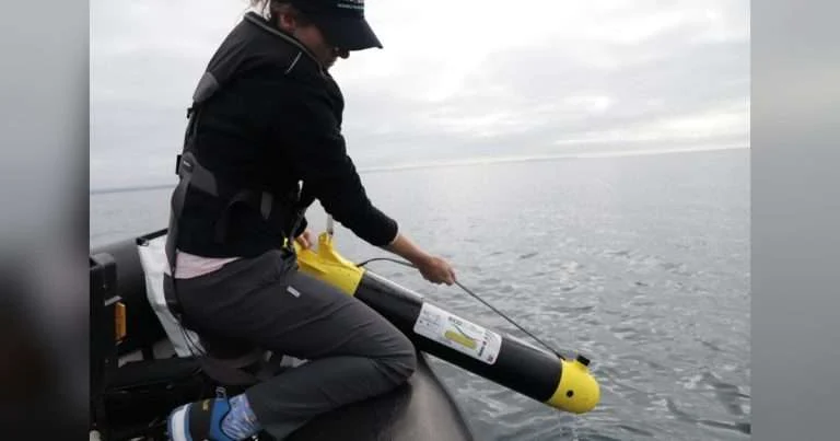 PML’s Dr. Juliane Wihsgott lowering an ecoSUB into the water. (Image credit: PML)