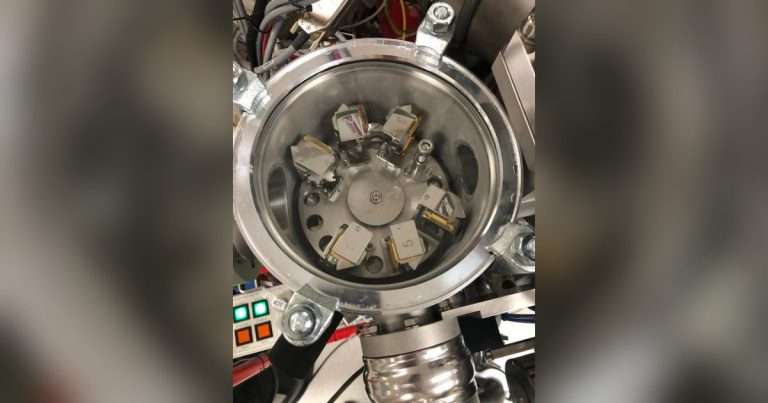 The chamber of an ion microprobe, an advanced instrument that occupies an entire room at UCLA. The instrument measures oxygen isotopes in salmon otoliths, or ear bones, inside the chamber to determine temperatures the fish experienced inside their eggs. (Image credit: Rachel Johnson, NOAA Fisheries)