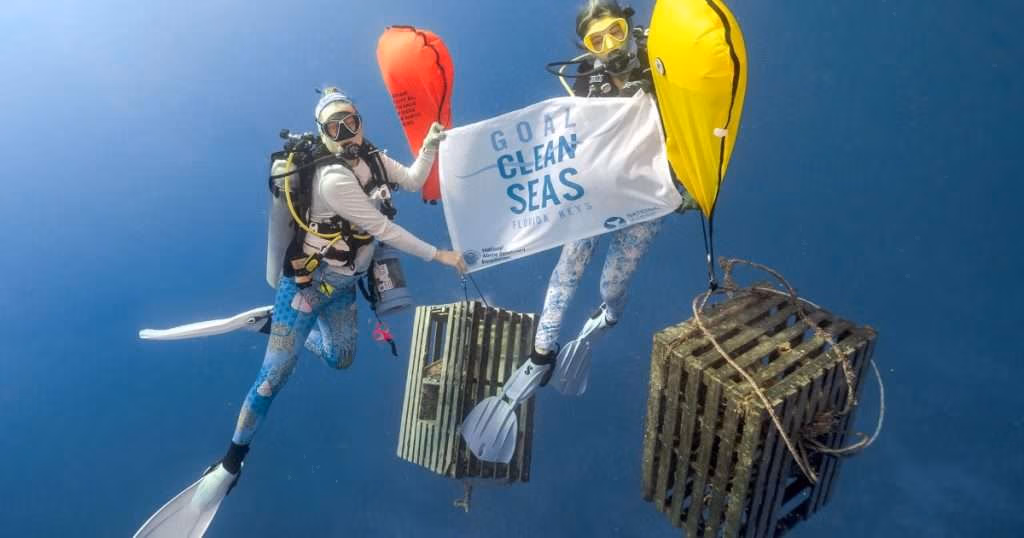 Divers with National Marine Sanctuary Foundation bring derelict spiny lobster traps to the surface using air-filled buoys. (Image credit: National Marine Sanctuary Foundation)