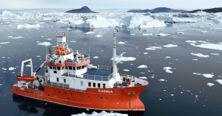 R/V Sanna with Tuttulikassaap Sermia (Hayes Glacier) in the background during the recent expedition. (Credit: Aurora Roth, Harvard/SIO)