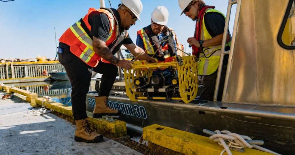 Research team deploying a subsea drop camera system (Image credit: SubC Imaging)