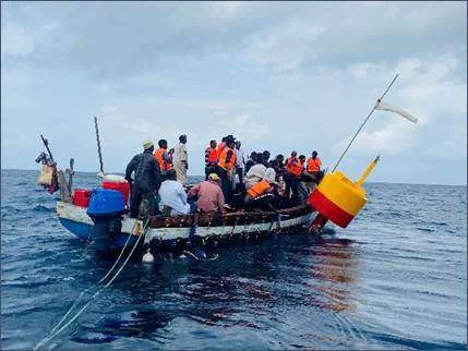 An ocean acidification monitoring buoy being deployed (left) and in position (right) off Pemba under TAFIRI and IUCN oversight, September 2024. (Image credit: IUCN)