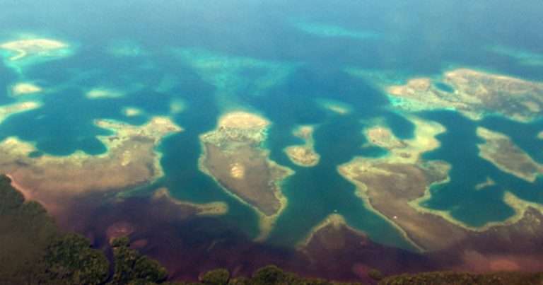 Coastline of (North) Sulawesi, Indonesia: Coral reefs, mangrove forests, and seagrass beds are closely interconnected and together form a “tropical triad” of coastal ecosystems. (Credit: Sebastian Ferse, ZMT)