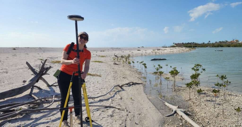 Research Geologist Rose Palermo records elevation for a sediment core collected on Silver Key, FL. (Image credit: USGS)